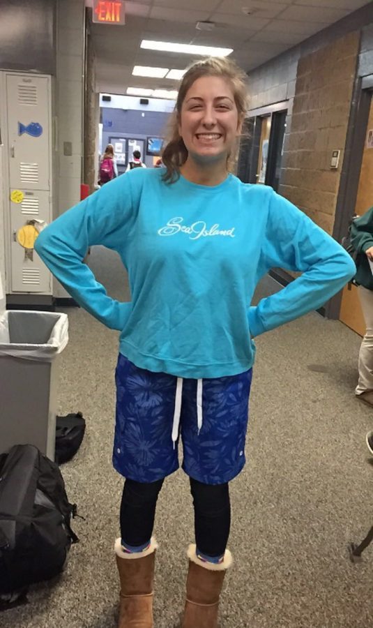 Senior Annabelle Tomlin rocks a pair of patterned blue board shorts on Tropical day. (Photo by Hadley Neal)