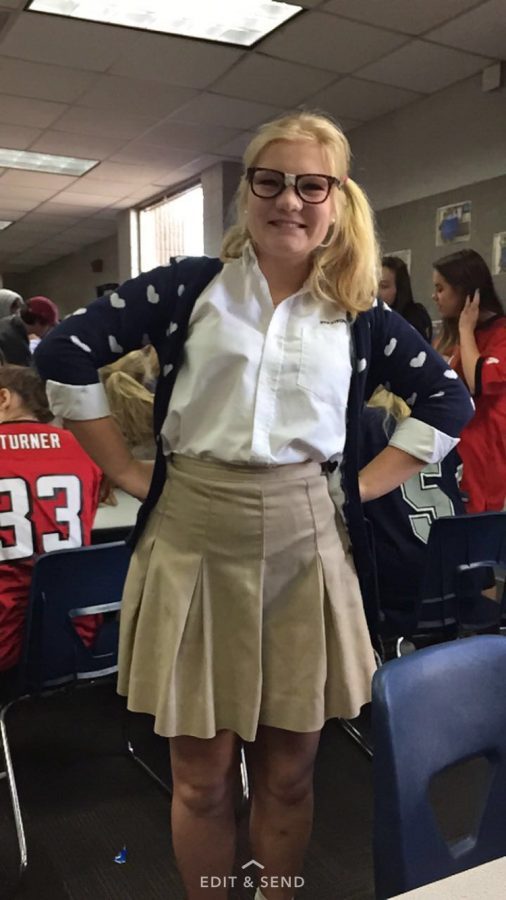 Marta Stevenson opted to dress like a mathlete on Friday, rocking a blue sweater with hearts on it and the ever classic glasses-with-tape.