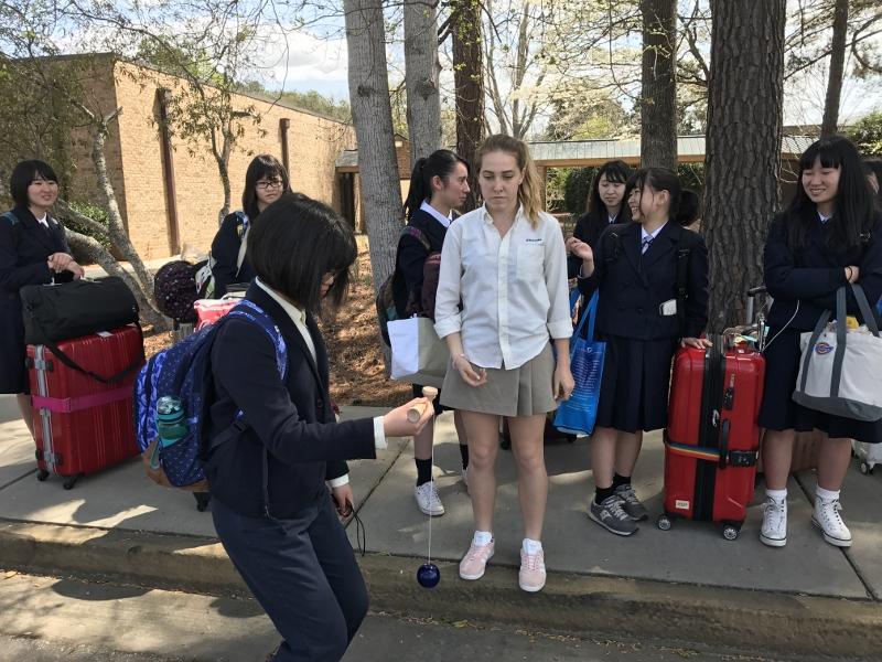 Vannah Zawacki watches as Li-an Tsai attempts Kendama