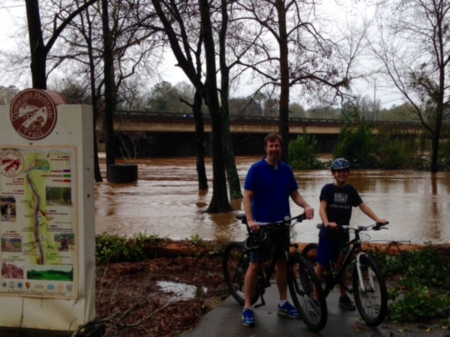 Freshman Charles Upshaw and his father, Dr. James Upshaw, bike on the Ocmulgee River Trail.