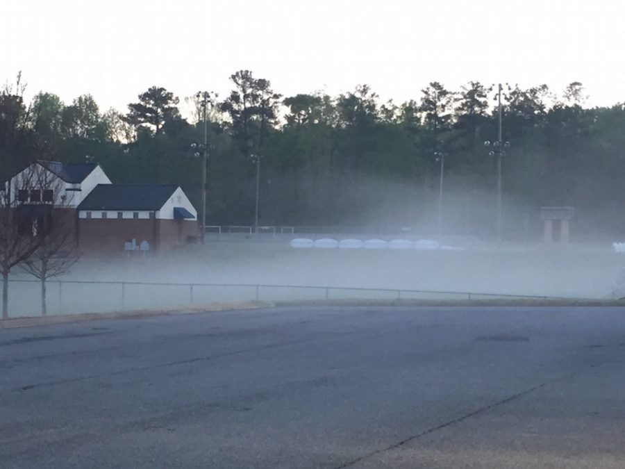 An early morning fog settles over the soccer practice field on Tuesday.