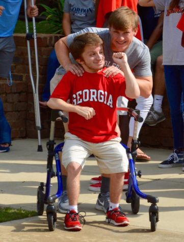 Aaron Arnold and Crawford Edwards share a moment on Friday -- the last day of classes for seniors 