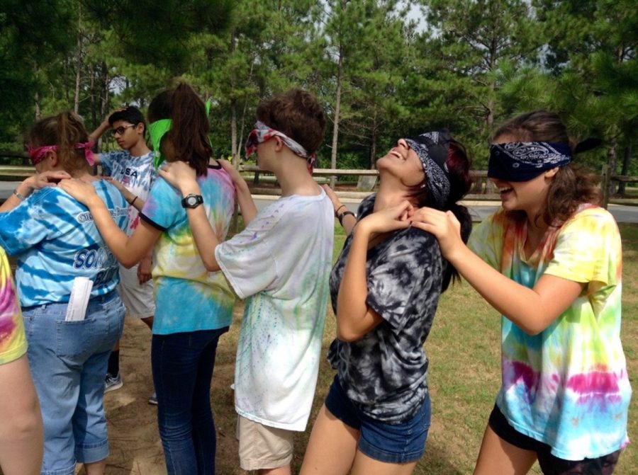 Ms. Haynie, Lauren McElrath, Shaw London, Alexandra Hall, and Maddie Fackler line up blindfolded to go through an obstacle course. 
