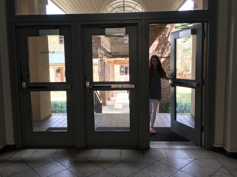 Freshman Kendall Simmons avoids the middle door at the front entrance, a longtime Stratford superstition.