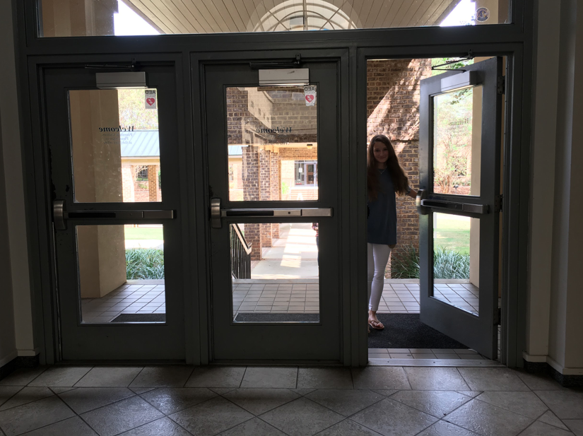 Freshman Kendall Simmons avoids the "middle" door at the front entrance, a longtime Stratford superstition.