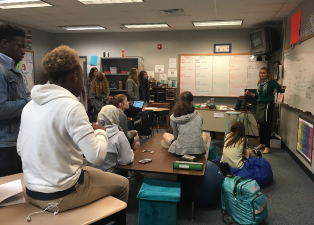 French Club members get instructions from Mrs. Chabot at recent meeting.