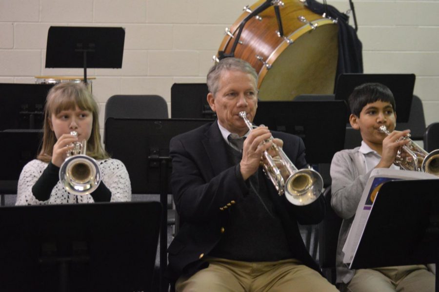 Dr. Veto joins the trumpet section with Zoe and fifth-grader Ahmed Shabbir during Lower School Band.