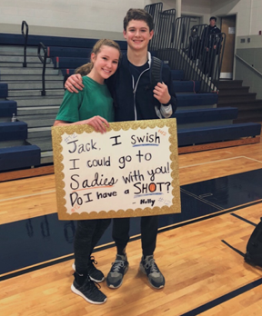 Sophomore Holly Hunt asked Freshman Jack Miscall after their basketball games at Mount De Sales Academy with a sign that said Jack, I SWISH I could go to sadies with you? Do I have a shot? - Holly, #12 