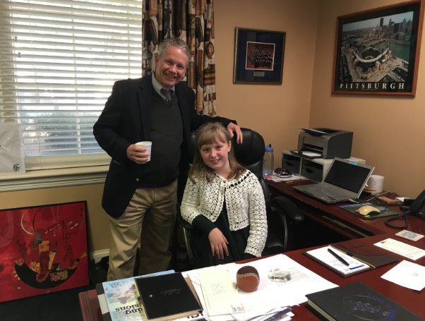 Zoe McAfee gets to sit in the chair of Dr. Bob Veto in his office Thursday morning