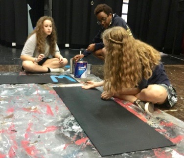 Theatre class members Mary Kate Groves, Sarah Pyles and Katherine Hall work on the set for the upcoming winter musical.