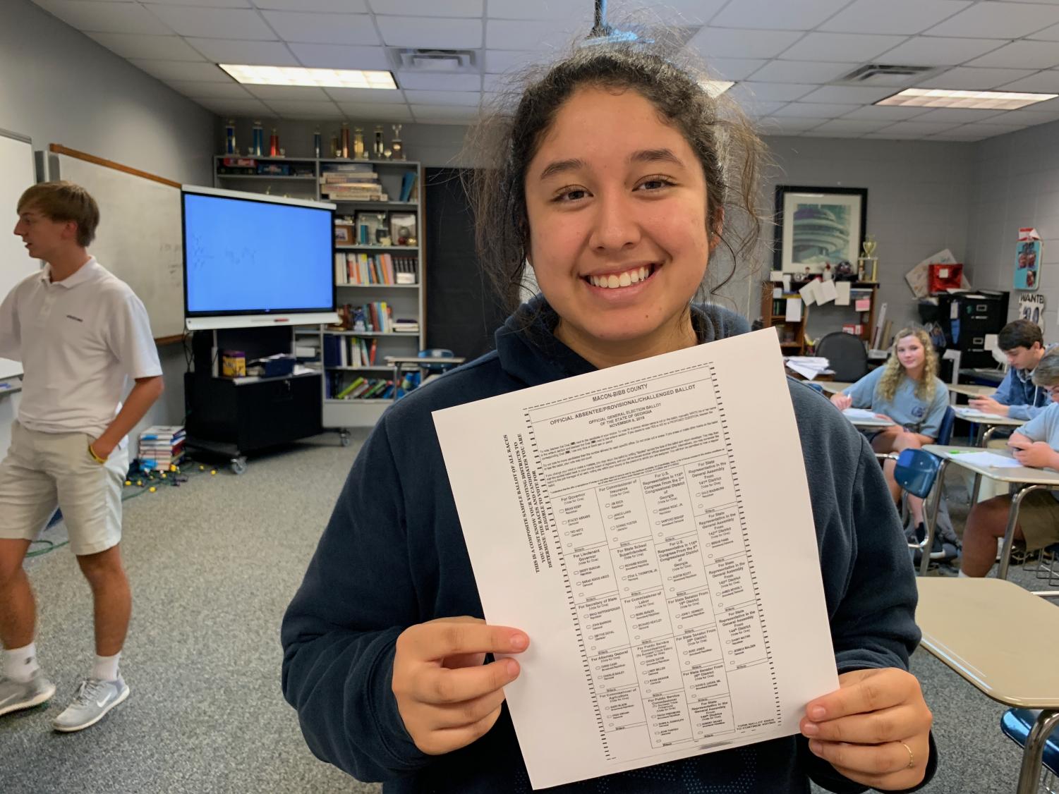 Alyssa Ferland holds a ballot for this year's election