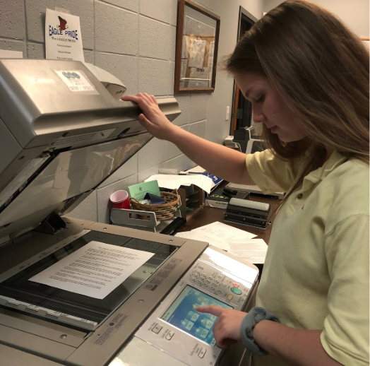 Senior Kailey Bohan makes copies for the college office