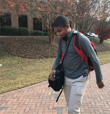 On school days, ninth-grade student James Burrell spends almost 90 minutes riding to school and returning to his home in Jackson