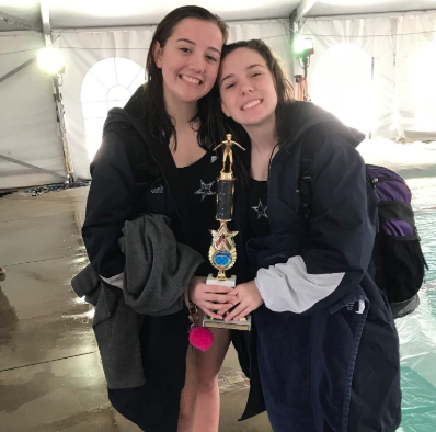Haley Ellison, right, with her sister, Abby, after a swim meet