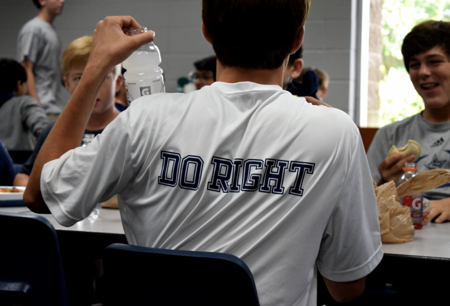 Parker Epps, wearing his Do Right T-shirt enjoys a laugh at lunch with Wes Kovacs (right)