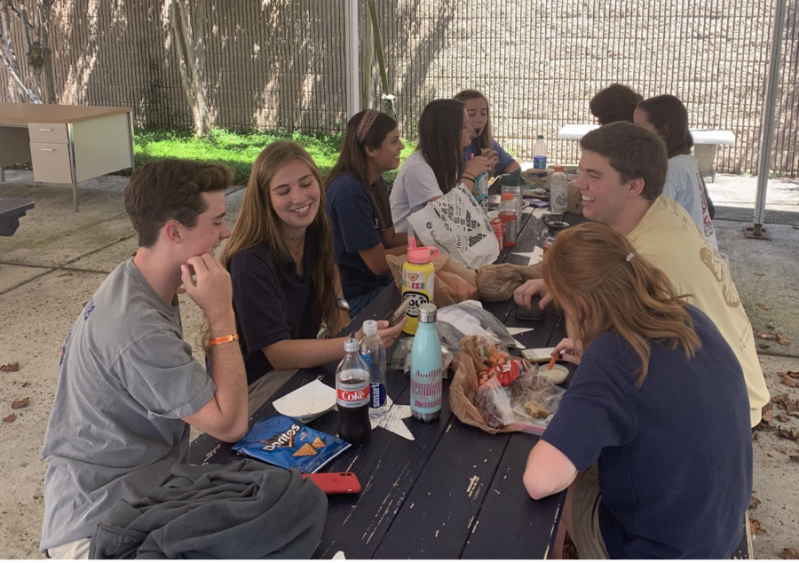Seniors enjoy lunch break on the patio