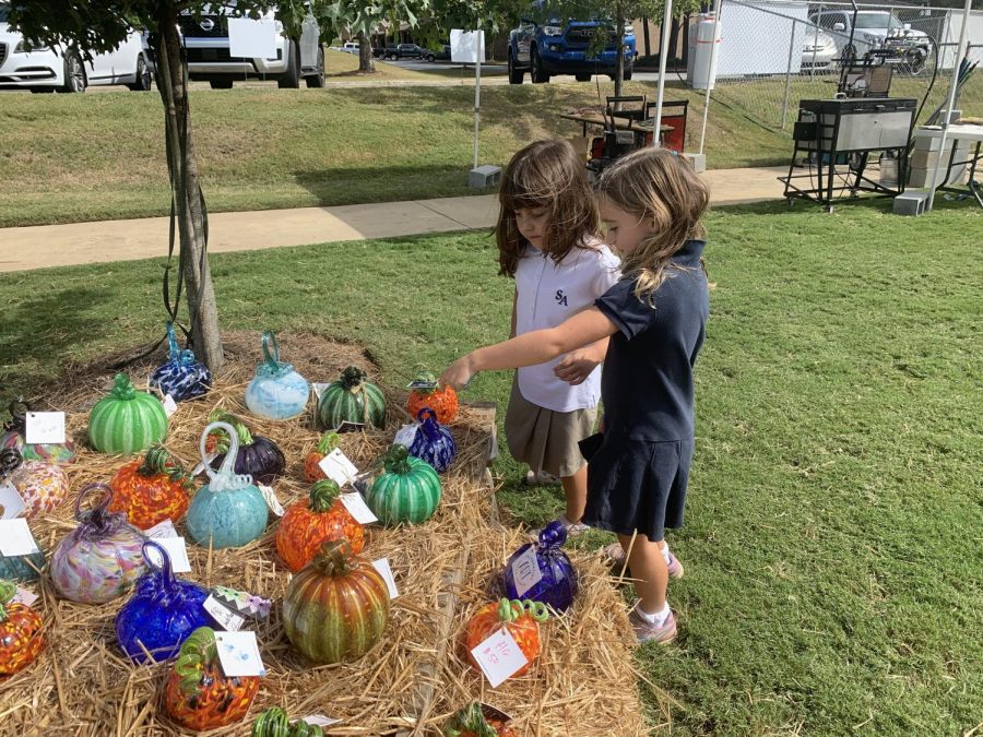 ____ and ____ finding their favorite glass pumpkin. 