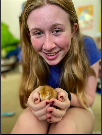 Nora holding a baby chick