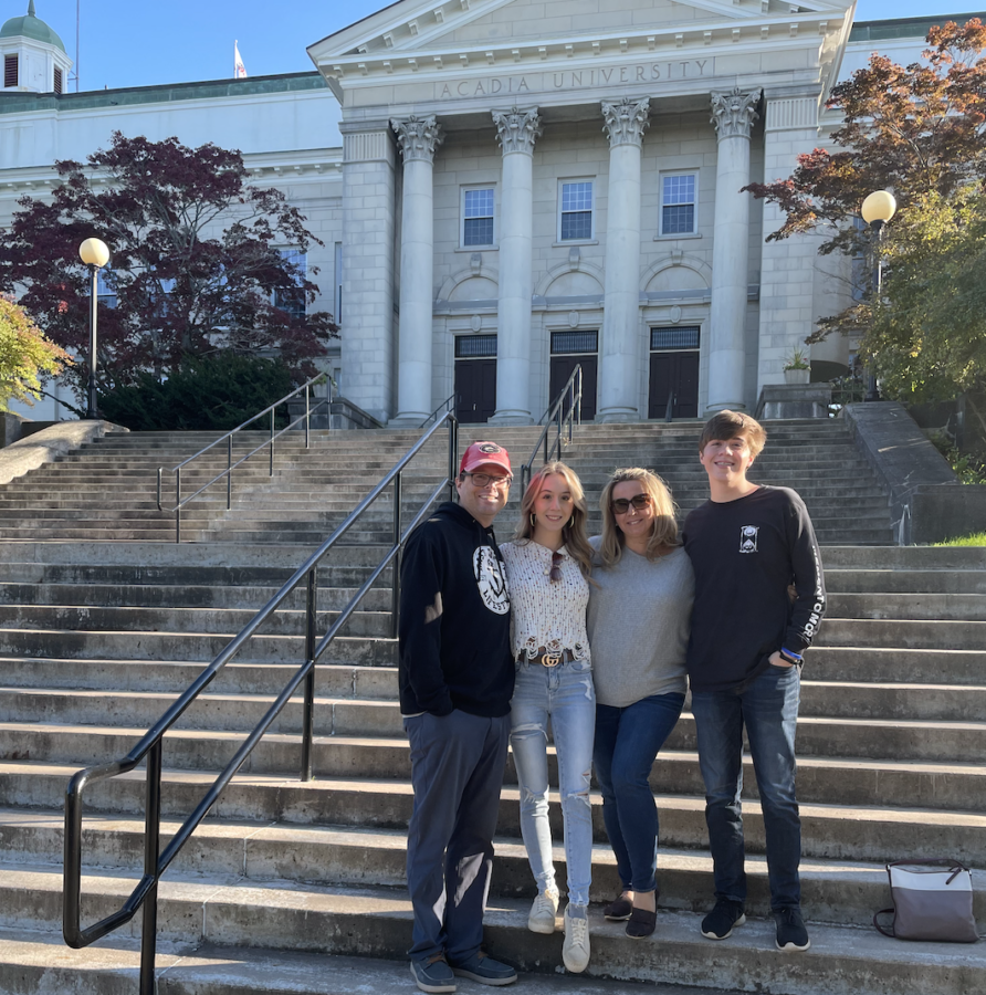 Senior Brandon Firlotte, right, visits Acadia University in Wolfville, Nova Scotia with his family in October